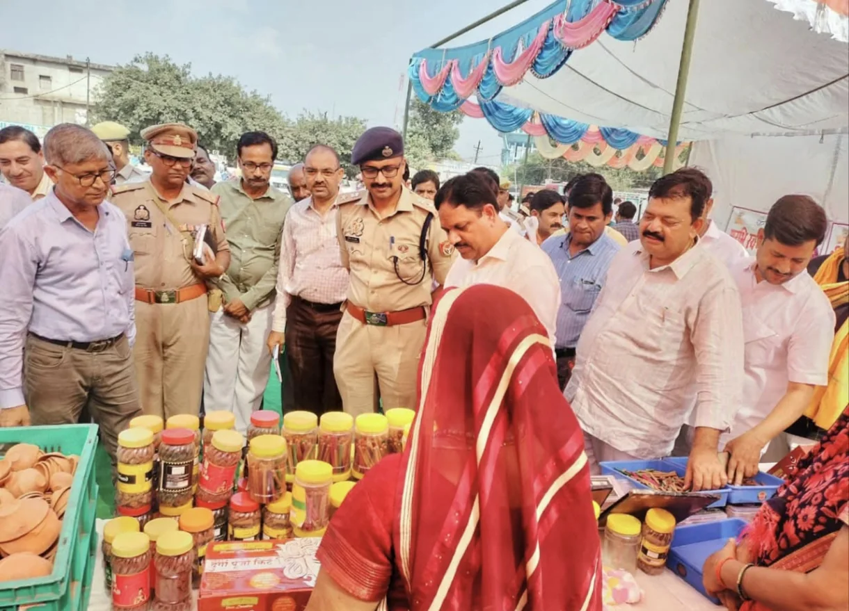 Visitors and officials viewing Aradhya products